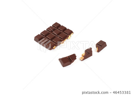bar of dark chocolate with hazelnuts. Pieces of chocolate with nuts, isolated on white background. 46453381