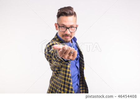 People and gesture concept - young man invite you to go with him, smiling, wearing glasses People and gesture concept - young man invite you to go with him, smiling, wearing glasses 46454408