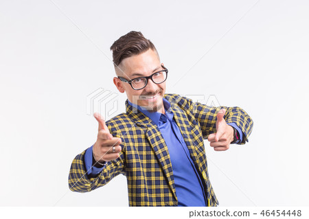 Emotion, people and gesture concept - young handsome stylish man pointing on you on white background Emotion, people and gesture concept - young handsome stylish man pointing on you on white background 46454448