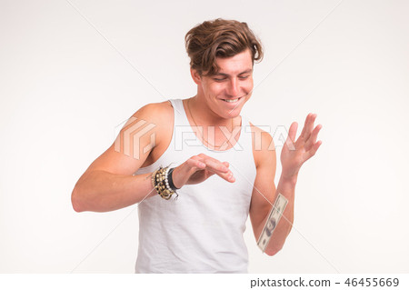 Concept of financial wealth, prosperity and lottery winnings - Man throwing away his money on white 46455669