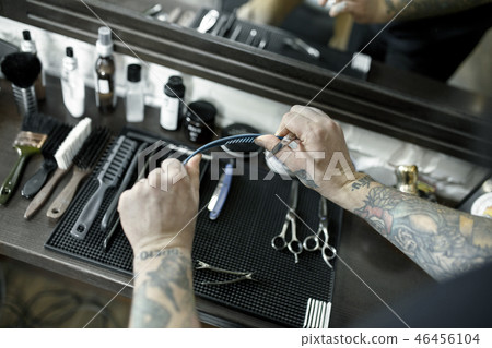 Tools for cutting beard barbershop top view. Vintage tools of barber shop on wooden background Tools for cutting beard barbershop top view. Vintage tools of barber shop on wooden background 46456104
