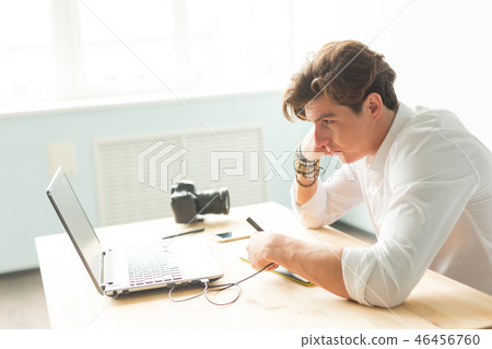 People, working and graphic tablet - young graphic designer in home office working on laptop People, working and graphic tablet - young graphic designer in home office working on laptop 46456760