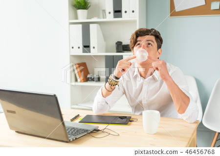 young man in suit having fun in the office young man in suit having fun in the office 46456768