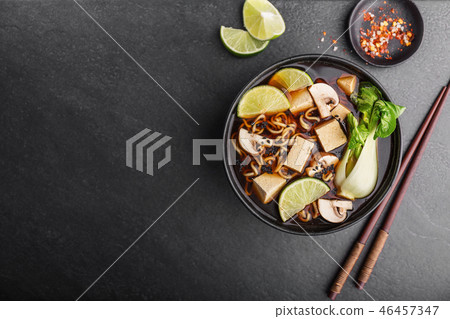 Tofu asian vegetarian soup served in bowl 46457347