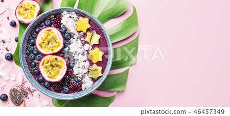 Smoothie acai bowl served in bowl on pink table 46457349