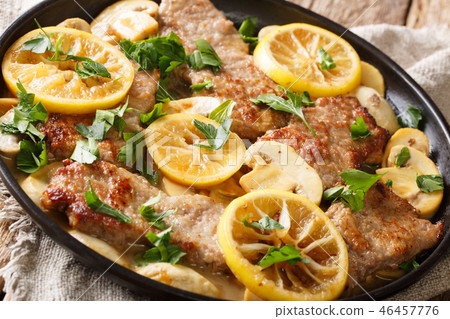 Scaloppini veal cooked with mushrooms Scaloppini veal cooked with mushrooms 46457776