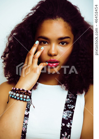 young pretty african american girl emotional posing on white bac young pretty african american girl emotional posing on white bac 46458454