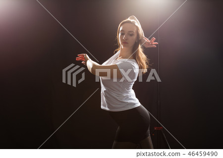 People and dancing concept - Close up of young athletic woman dancing street dance in studio 46459490