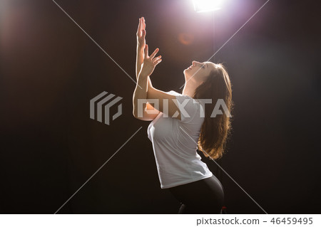 People and dancing concept - Close up of young athletic woman dancing street dance in studio People and dancing concept - Close up of young athletic woman dancing street dance in studio 46459495