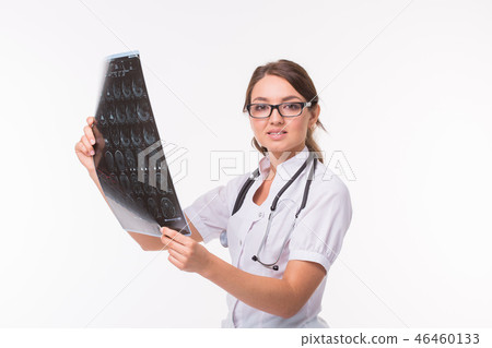 Young female doctor looking at x-ray image on white background. Mri scan, magnetic resonance Young female doctor looking at x-ray image on white background. Mri scan, magnetic resonance 46460133