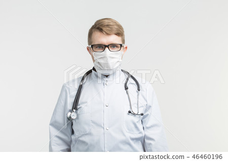 Health and medicine - doctor wearing the stethoscope and white mask on white background 46460196