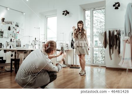 Amazing young model in a beige dress posing for the photo 46461426