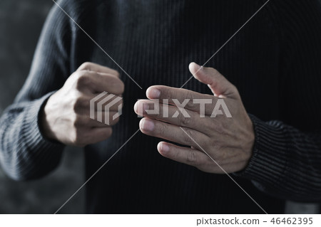 young man with a threatening gesture young man with a threatening gesture 46462395