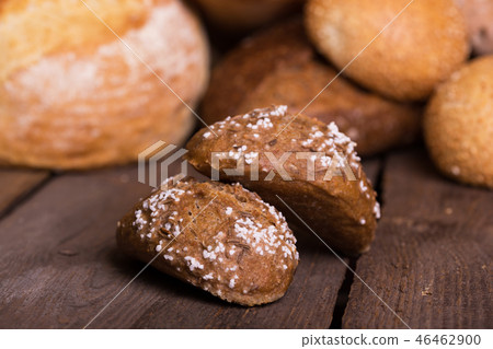 fresh bread and wheat on the wooden 46462900