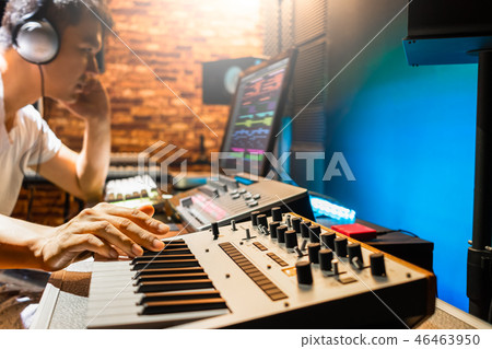 asian male composer making music in sound studio asian male composer making music in sound studio 46463950