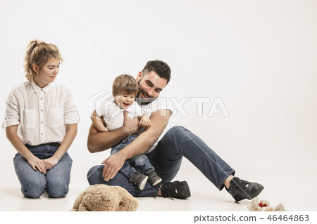 happy family with kid sitting together and smiling at camera isolated on white happy family with kid sitting together and smiling at camera isolated on white 46464863