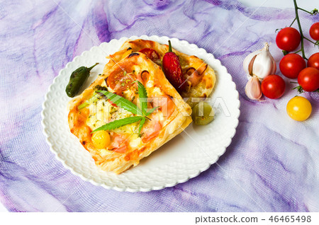 Pizza pastry with marijuana on a plate top view 46465498