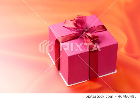 A gift tied with a ribbon A gift tied with a ribbon 46466483