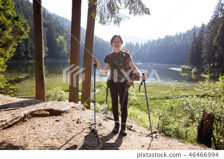 tourist girl on a mountain lake 46466994