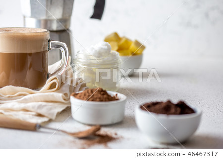 KETOGENIC KETO DIET DRINK. Coffe and cacao blended with coconut oil. Cup of bulletproof coffe with 46467317