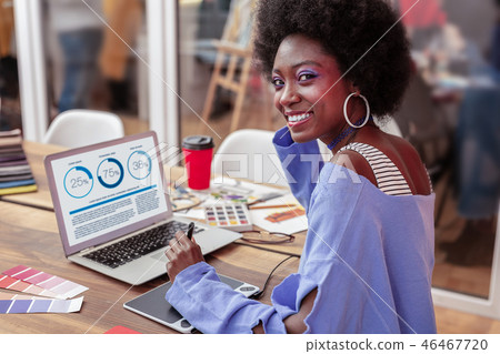 Manager of creative fashion project smiling while working 46467720