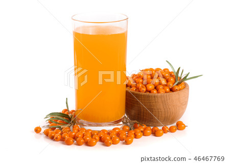 Sea buckthorn juice in a glass and wooden bowl with berries isolated on white background Sea buckthorn juice in a glass and wooden bowl with berries isolated on white background 46467769