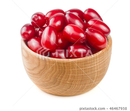 dogwood berry in a wooden bowl isolated on white background dogwood berry in a wooden bowl isolated on white background 46467938