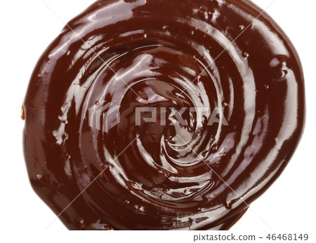 Hot melted chocolate pouring isolated on white background, top view 46468149