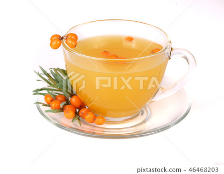 Sea buckthorn tea in a glass with berries isolated on a white background Sea buckthorn tea in a glass with berries isolated on a white background 46468203