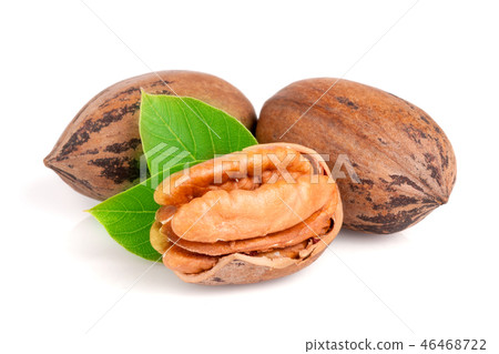 Three pecan with leaves isolated on white background 46468722