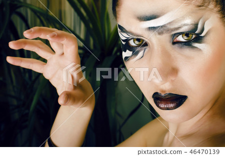 beauty young woman with creative make up like zebra closeup, wav 46470139