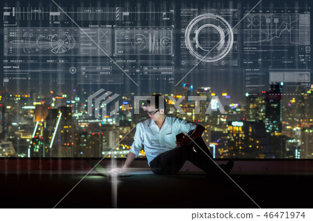 Asian businessman sitting and using the laptop showing digital virtual screen over the cityscape background at night time, Business technology and innovation concept Asian businessman sitting and using the laptop showing digital virtual screen over the cityscape background at night time, Business technology and innovation concept 46471974