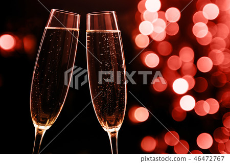 Two glasses of champagne on black stylish background. Place 46472767