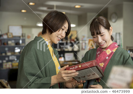 Yukata-style woman who sees souvenirs at a hot spring inn shop Women trip image 46473999