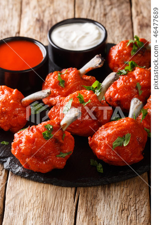 Lollipops deep-fried red chicken wings with sauce Lollipops deep-fried red chicken wings with sauce 46477689