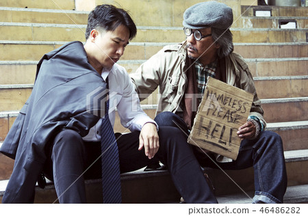 Homeless man Consolation business man on walking s 46486282