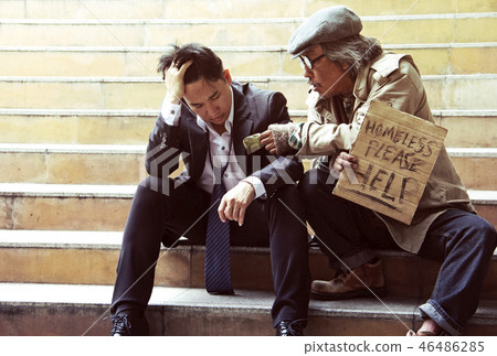 Homeless man Consolation business man on walking Homeless man Consolation business man on walking 46486285
