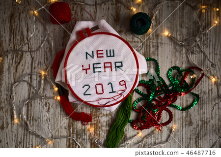 Sewing by hand NEW YEAR 2019 red and green threads Sewing by hand NEW YEAR 2019 red and green threads 46487716