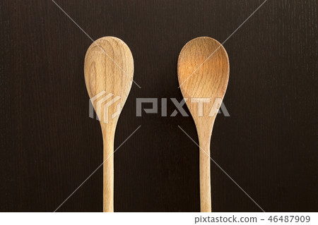 Wooden spoons on black table Wooden spoons on black table 46487909