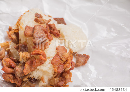 pork fried with sticky rice on wrap paper pork fried with sticky rice on wrap paper 46488384
