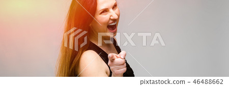 Emotional pretty confident positive plus size model standing in studio pointed finger at camera on Emotional pretty confident positive plus size model standing in studio pointed finger at camera on 46488662