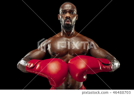 Hand of boxer over black background. Strength, attack and motion concept 46488703