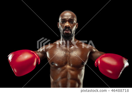 Hand of boxer over black background. Strength, attack and motion concept Hand of boxer over black background. Strength, attack and motion concept 46488718