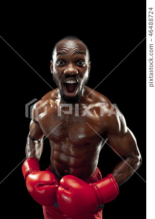 Hand of boxer over black background. Strength, attack and motion concept 46488724