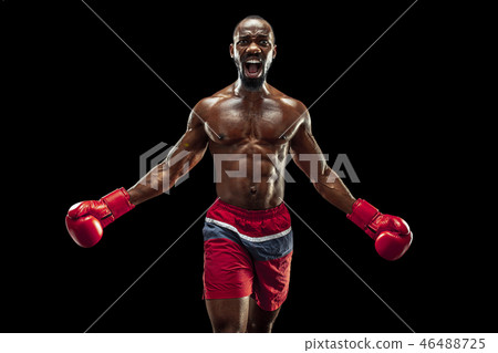 Hand of boxer over black background. Strength, attack and motion concept Hand of boxer over black background. Strength, attack and motion concept 46488725
