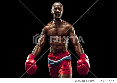 Hand of boxer over black background. Strength, attack and motion concept 46488727
