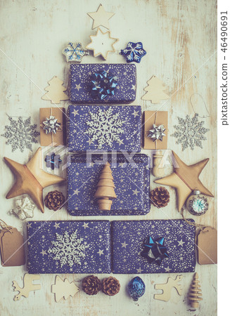 Presents in blue wrapping paper on table Presents in blue wrapping paper on table 46490691