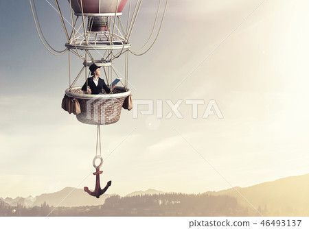 Woman traveling in aerostat Woman traveling in aerostat 46493137