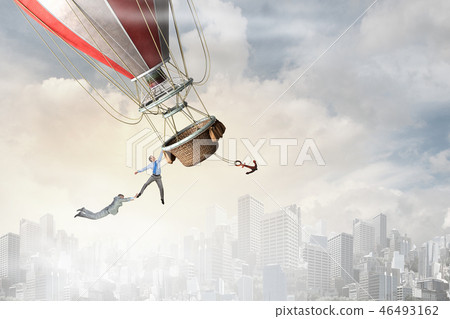 Woman and man flying on aerostat 46493162