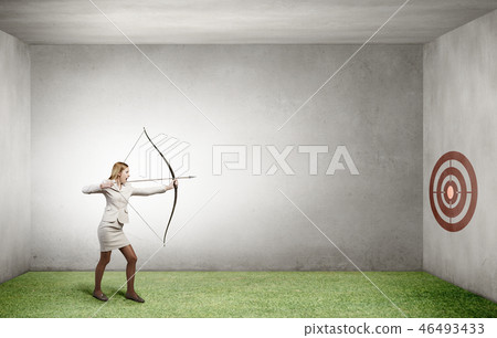 Woman aiming her goal Woman aiming her goal 46493433